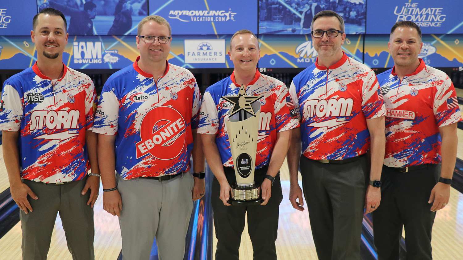 The members of Riding Kenny&#39;s Coattails holding the Joe Norris trophy at the 2024 USBC Open Championships